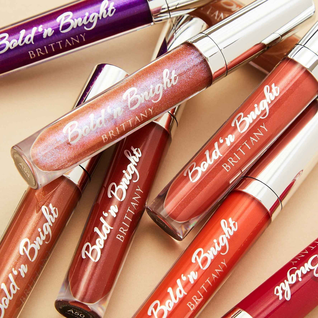 Close-up of lips wearing shiny pink lip gloss