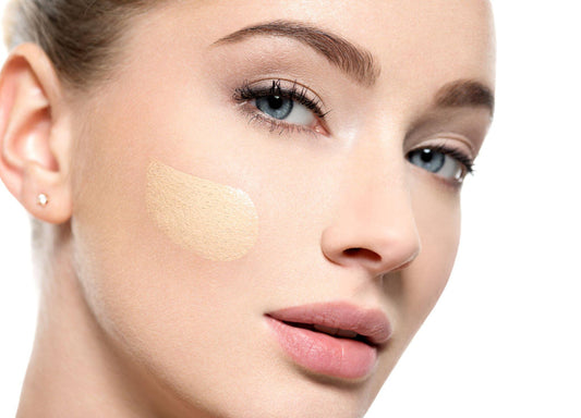 Woman with glowing natural skin wearing a light skin tint makeup look