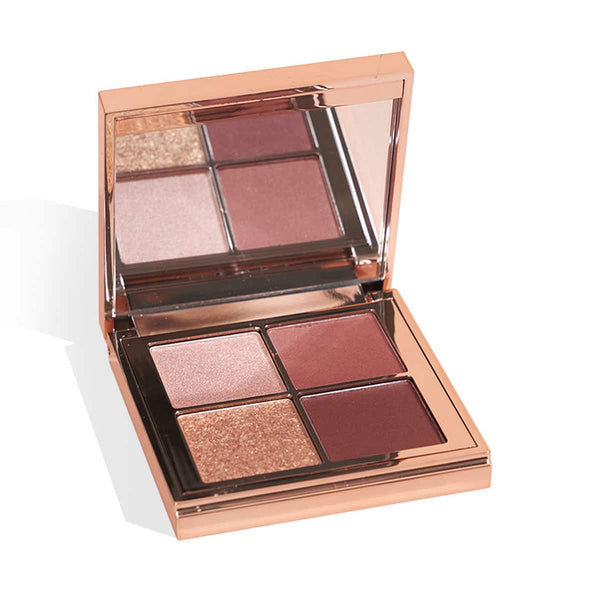Eyeshadow palette with 6 pressed pans in rose, plum, and shimmer shades.